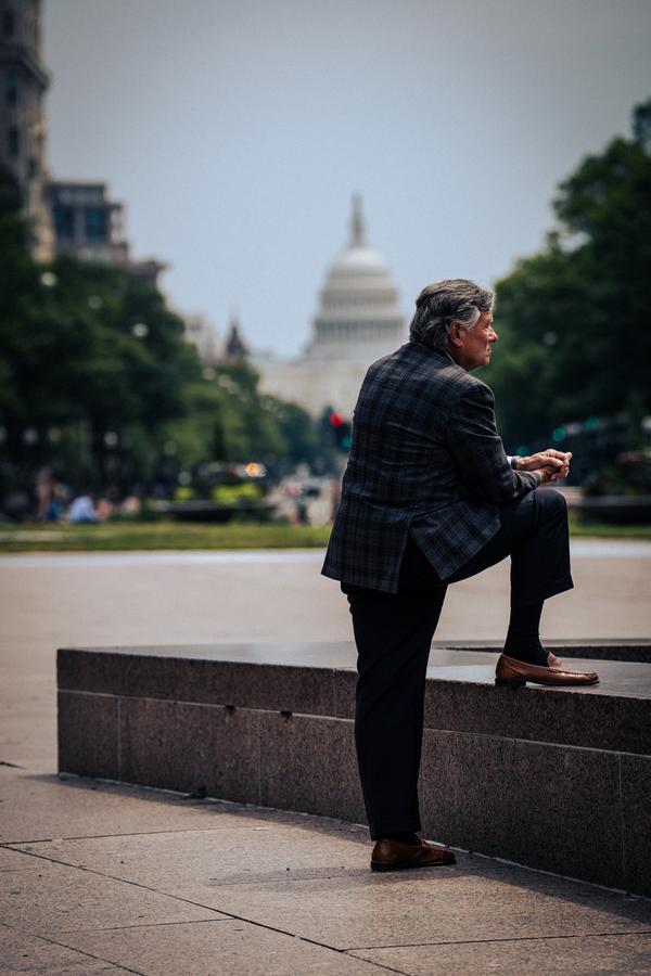 Man sitting near US Capitol building