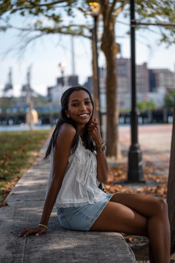 Woman portrait golden hour city background